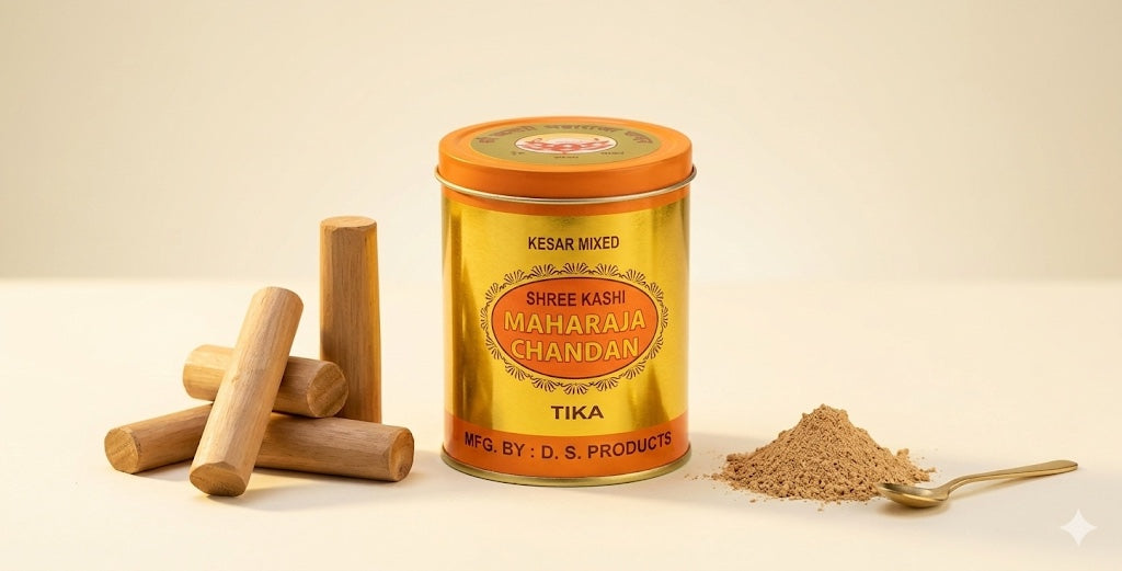 Gold-colored container of Shree Kashi Maharaja Chandan Tika with wooden sticks and powder on a beige background