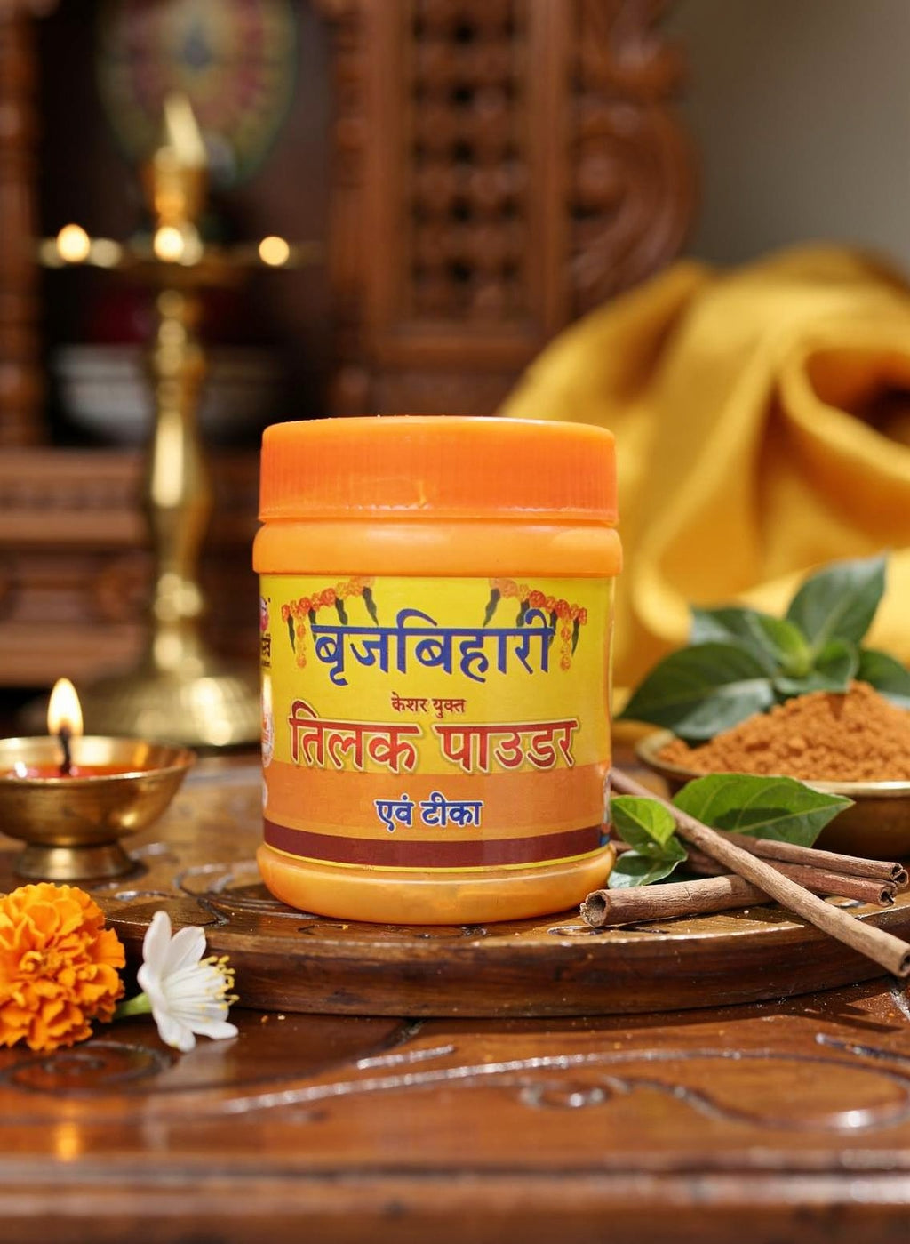 Jar of Brij Bhairavi Tilak powder on a wooden tray with decorative elements