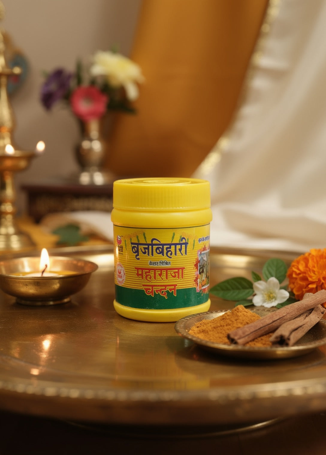 Yellow container with text on a table with spices and flowers