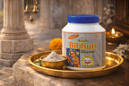 Kashi Bibhuti Bhasm container on a decorative tray with traditional elements in the background