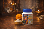 Kashi Bibhuti Bhasmam container with a bowl of powder on a decorative background