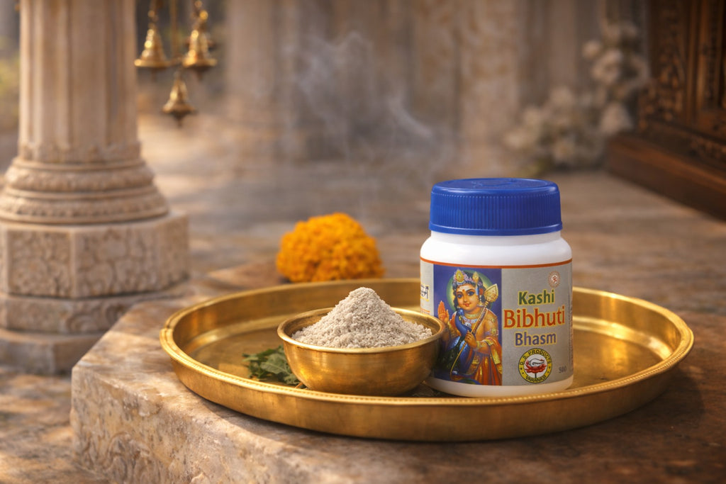 Kashi Bibhut Bhasm container on a golden tray with incense and flowers in a temple setting