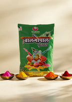 Green packet of Shahkh Holi colors with colorful powders in small bowls on a beige background