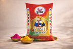 Colorful packaging of 'Raja' with two bowls of colored powder on a neutral background
