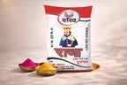 Bag of 'Raja' brand product with colorful powders on a neutral background