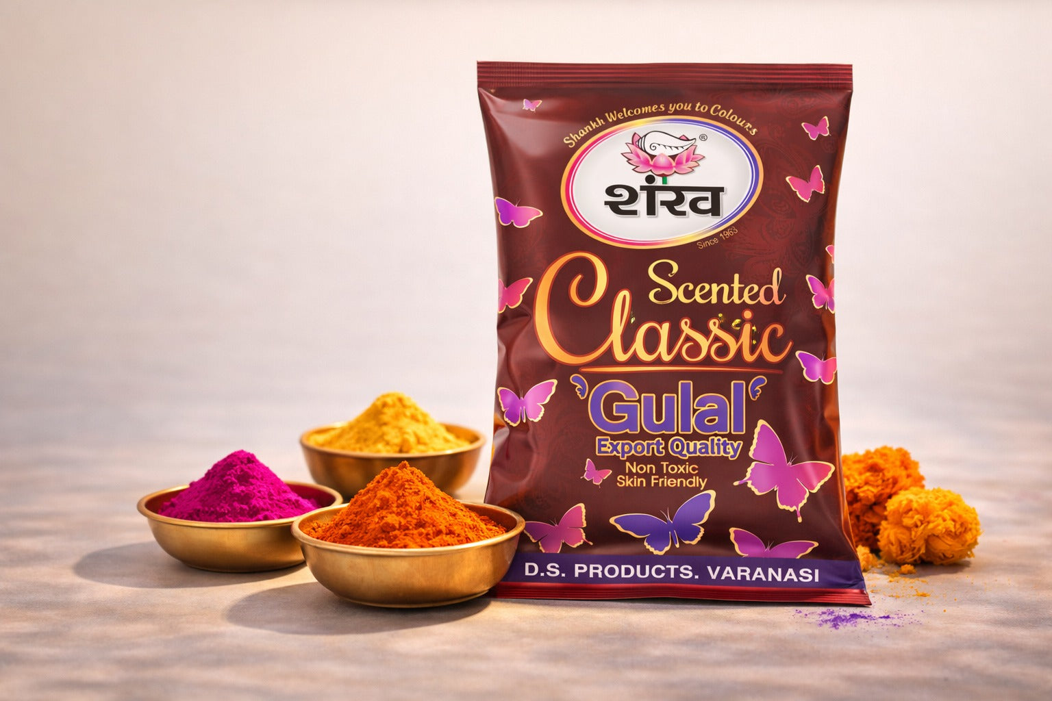 Bag of 'Scented Classic Gulal' with colorful powders and marigold flowers on a light background