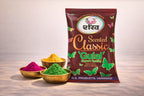 Shahnawaz Scented Classic Gulal packaging with colorful gulal powders on a wooden surface.