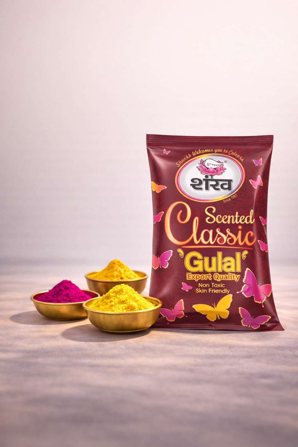 Scented Classic Gulal packaging with yellow and pink powders on a light background