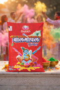 Red packet of Shahkh holi colors with people celebrating Holi in the background
