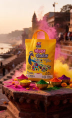 Yellow bag with colorful powders on a stone platform with a scenic background