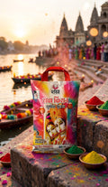 Colorful packet of 'Rama Krishan' on a stone ledge with a temple and river in the background