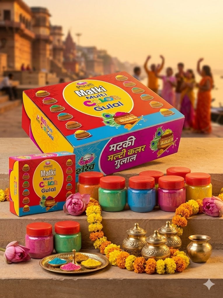 Colorful packaging of Makki Multi Color Gulal with decorative items on a scenic background.