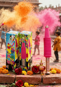Colorful firework launchers with Holi powder and flowers on a street background