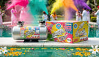 Color spray canister and box by a pool with people in the background