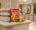 Puffed rice packet on a marble platform with temple architecture in the background