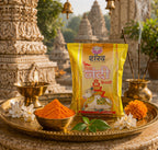 Shankar Nandi package on a tray with turmeric powder, flowers, and incense in front of a temple.