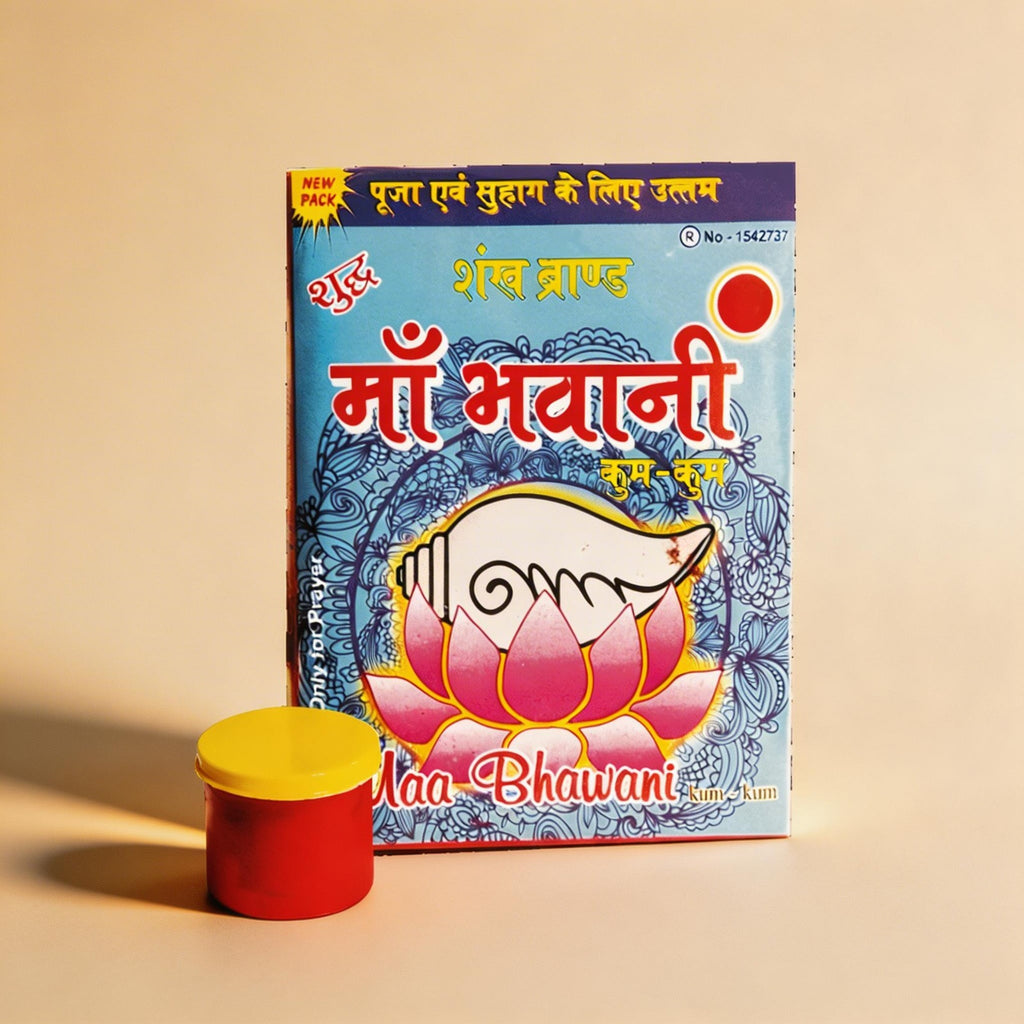 Book titled 'Maa Bhawani' with a red container on a beige background