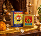 Two boxes of D.S. Products 303 Number Vermilion on a decorative table with flowers and candles.
