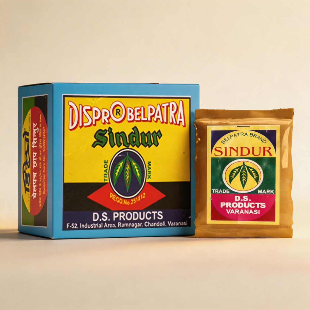 Box and packet of Dispro Belpatra Sindur on a beige background