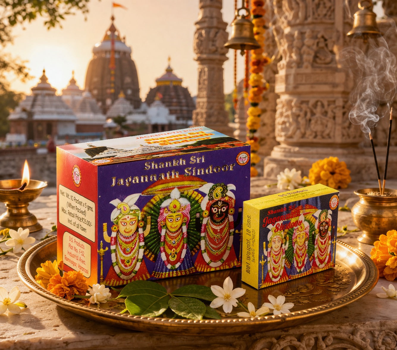Two small boxes with colorful designs on a tray in front of a temple.