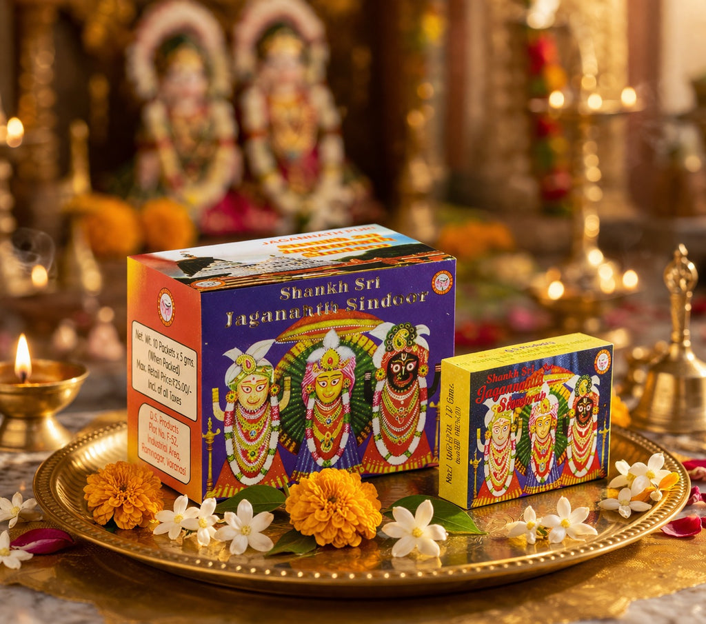 Two boxes of Shani Shri Jagannath Sindoor on a decorative tray with flowers and神像in the background
