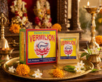 Shankh Brand vermillion packets on a decorative tray with flowers and religious items in the background