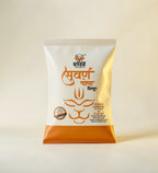 White and orange packaging with text and logo on a beige background