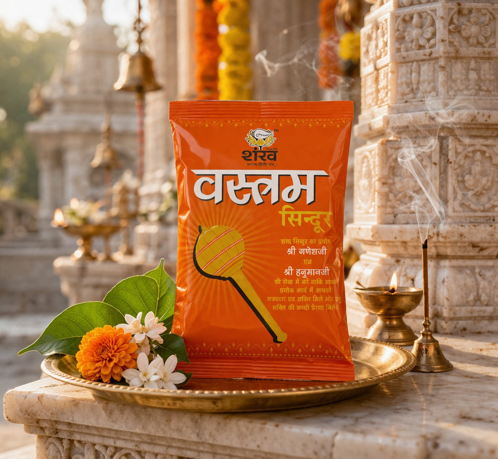 Orange packet with text on a decorative platform in front of temple architecture