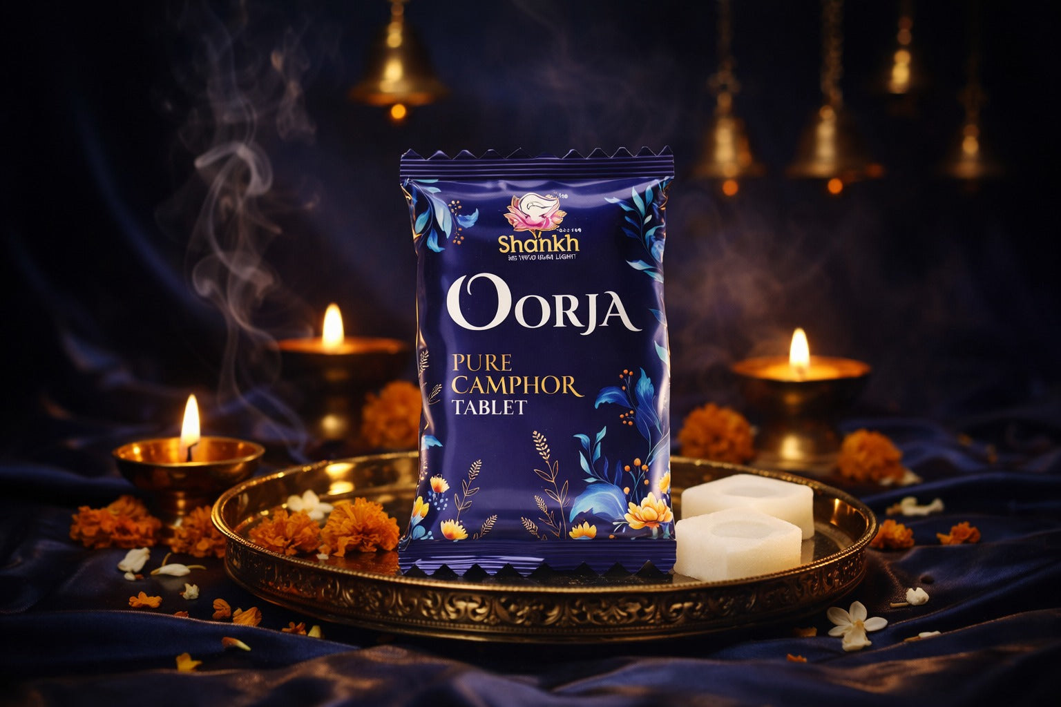 Shankh Oorja Pure Camphor Tablet packaging on a dark background with candles and flowers.