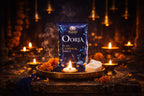 Shankh Oorja pure camphor tablet packaging on a dark background with candles and flowers.