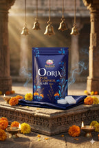 Shankar Oorja pure camphor slabs packaging on a traditional setting with flowers and lamps.