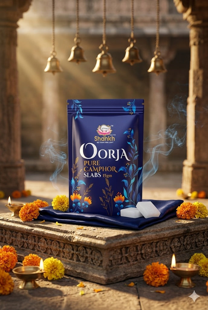 Shankar Oorja pure camphor slabs packaging on a traditional setting with flowers and lamps.