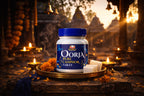 Oorja pure camphor tablet container on a decorative tray with candles and flowers in a temple setting