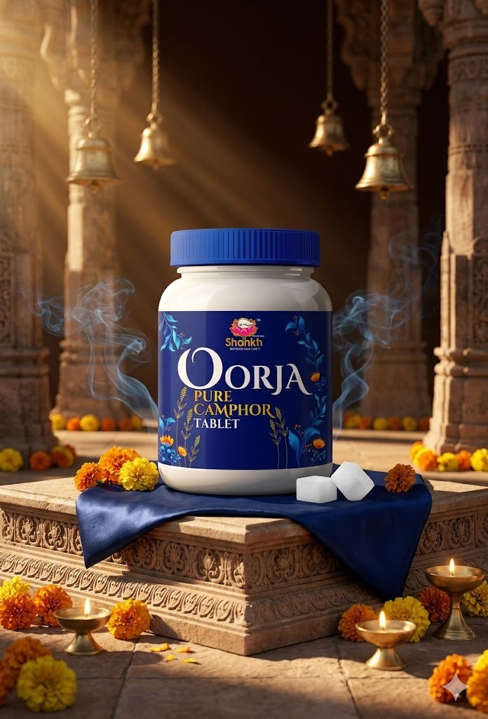 Oorja pure camphor tablet container on a decorative platform with flowers and candles.
