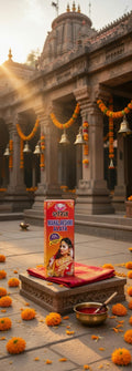 Red box on a platform with decorative elements in front of a temple.