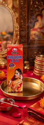 Box of Mahalakshmi Alata on a decorative setting with religious items