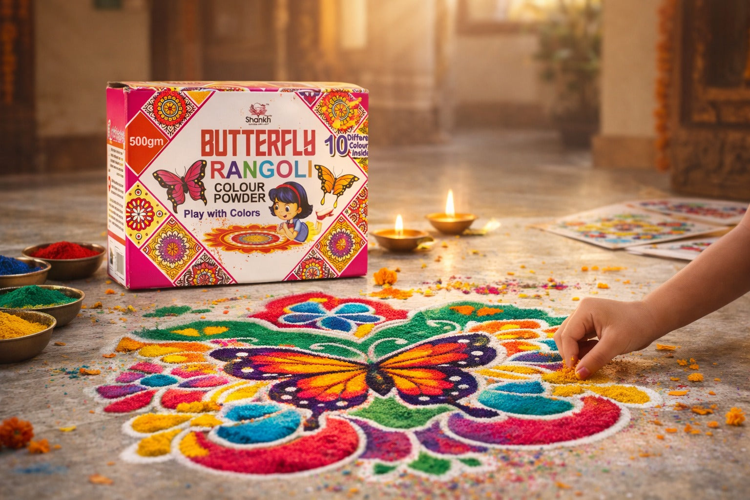 Butterfly rangoli color powder box with a colorful butterfly design on a wooden floor.