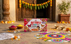 Butterfly Rangoli powder packaging with decorative rangolis on a traditional setting