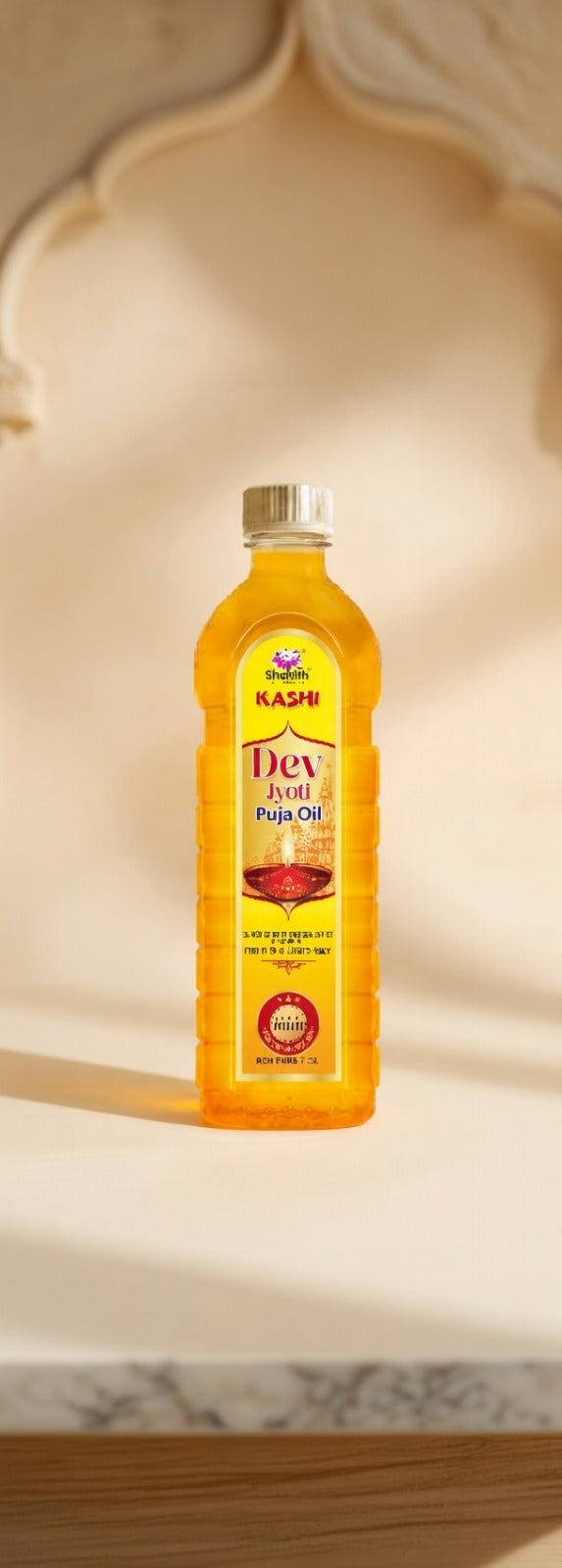 Bottle of Divya Pooja Oil on a marble surface with a decorative background