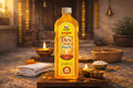 Kashi Dev Jyot Puja Oil bottle on a wooden platform with traditional items in the background