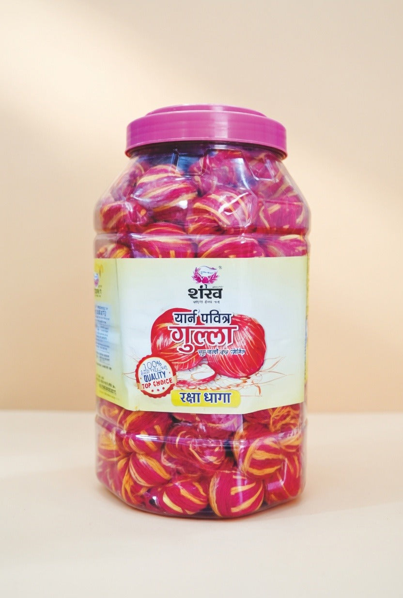 Jar of colorful candies with a pink lid on a white background