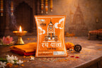 Orange packet with traditional design on a decorative table with flowers and a lamp.