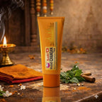 Tube of Kashi Chandan Tika on a rustic surface with decorative elements