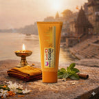 Kashi Chandan shampoo tube with traditional elements on a stone surface with a scenic background