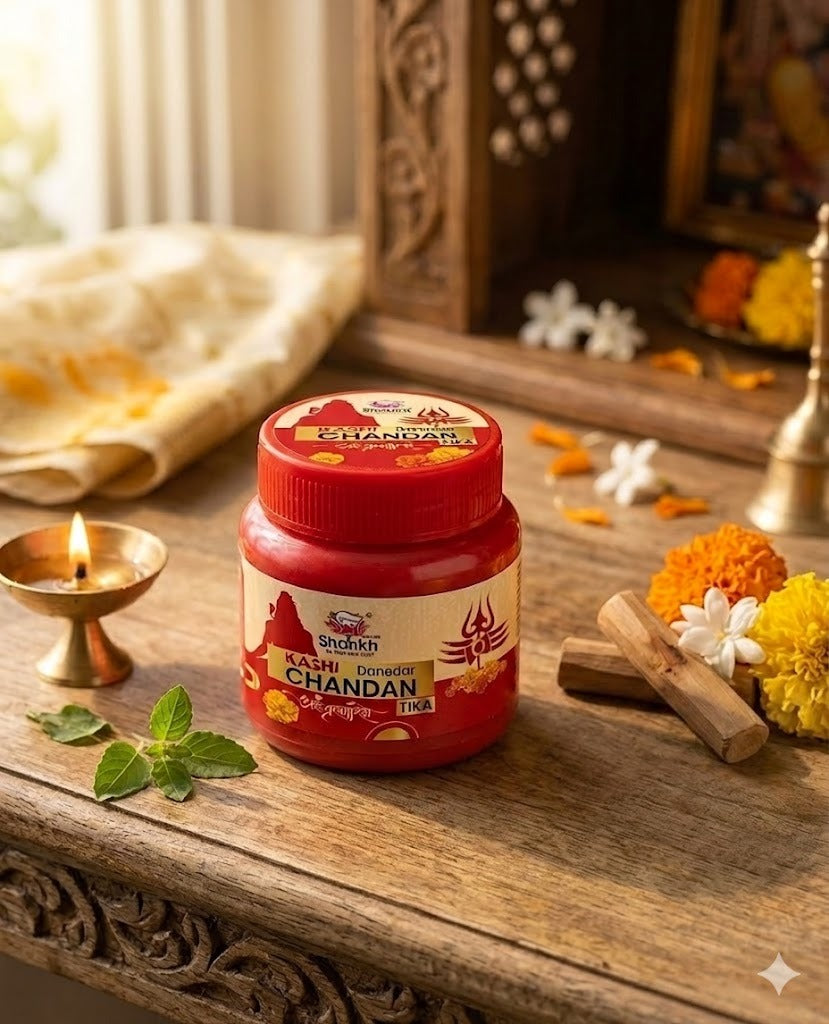Jar of Shahnaz Husain Kachi Chandan on a wooden surface with decorative items.