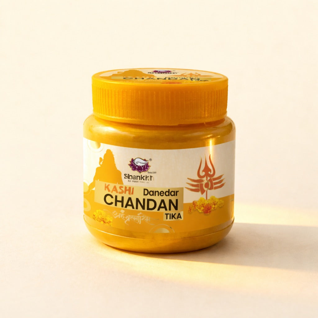 Jar of Kashi Danedar Chandan Tika on a light background