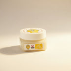 Jar of cream with a label on a beige background
