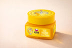 Yellow jar with a lid on a beige background