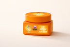 Orange jar with a label on a beige background