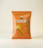 Orange packet of 'Vasam' with text on a light beige background